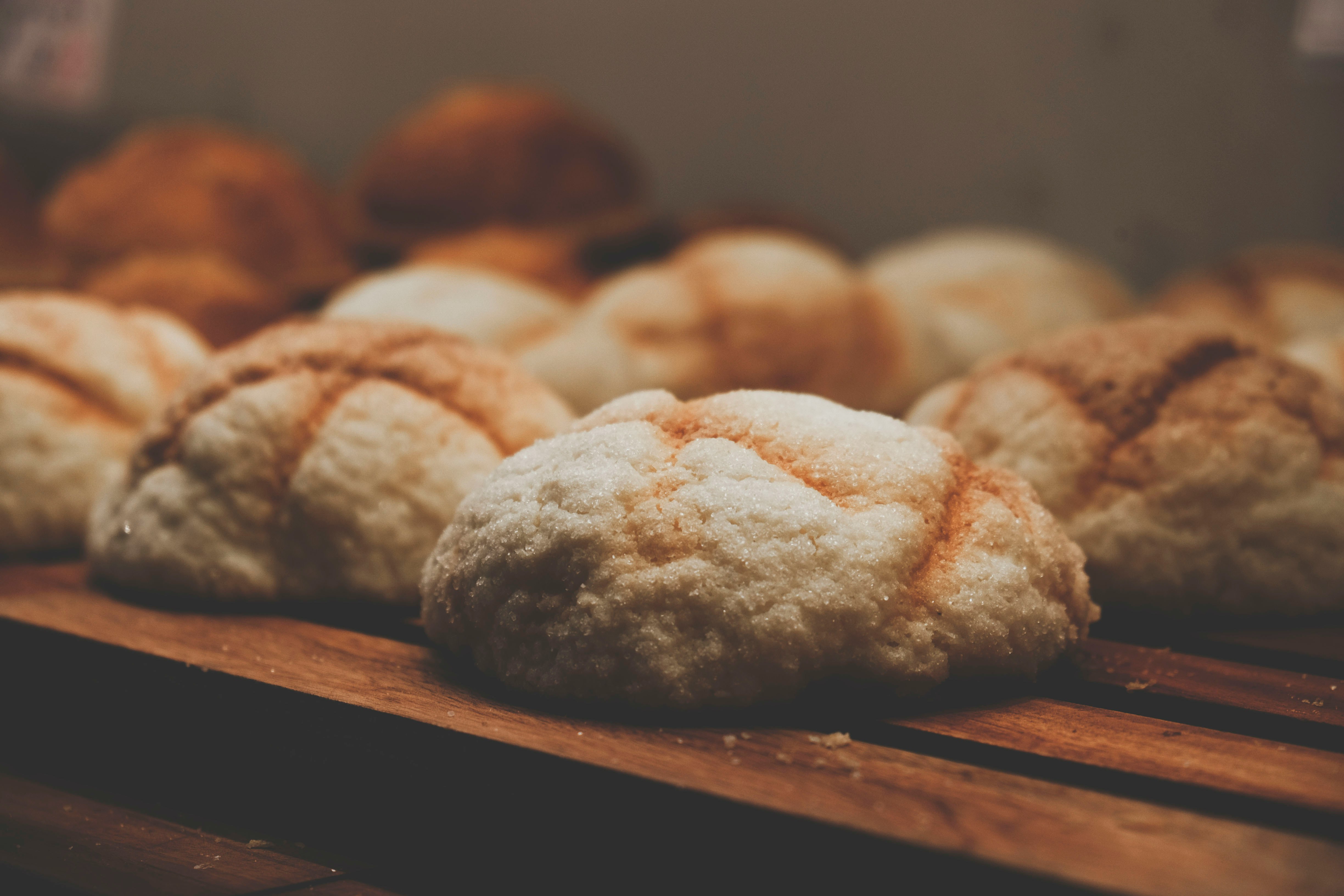 Soft golden pineapple bun with a crackled sugar top